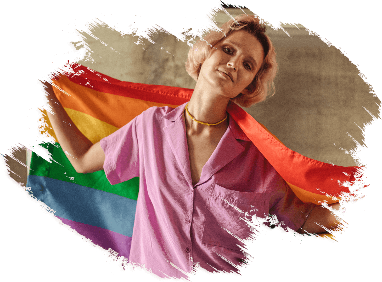 A woman holding onto the rainbow flag